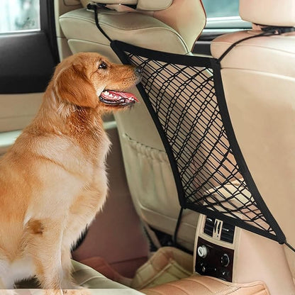 A 3-layer black car mesh organizer being used to store dog-related items while a dog sits in the foreground in a car setting.