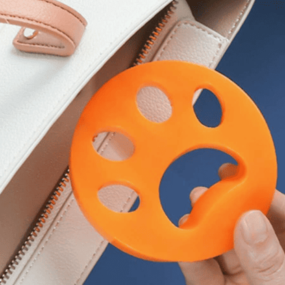 Reusable washing machine lint remover image, captures lint, pet hair, and fabric fuzz during laundry cycles
