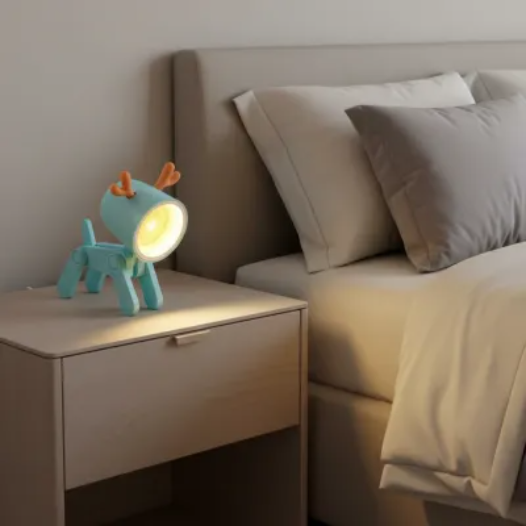 Toy lamp on a nightstand next to a bed