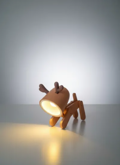 Dog-shaped lamp on a gray surface with a plain background