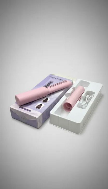 Makeup brush set with pink handle and white bristles in packaging on a gray background