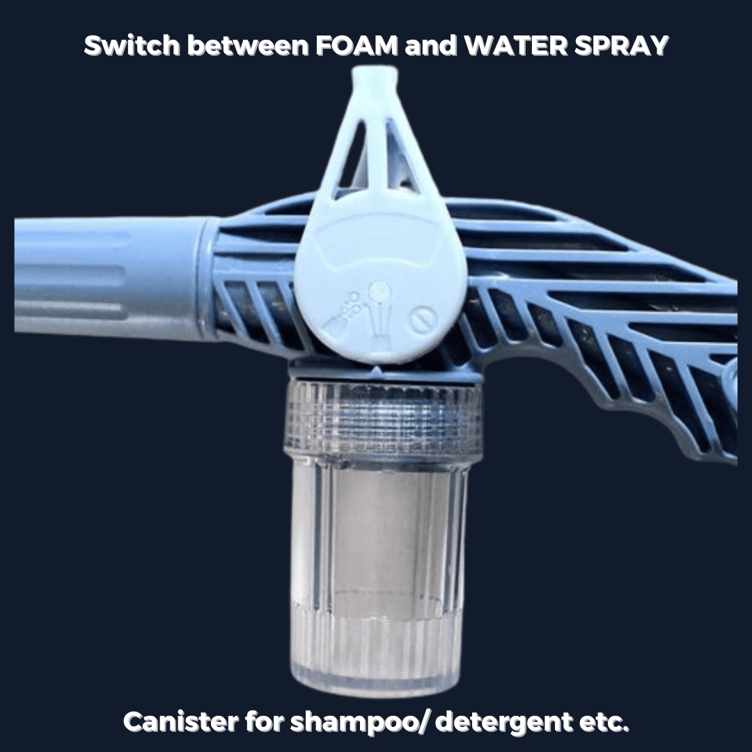 Strong water spray from pressure gun rinsing foam off car for spotless finish.