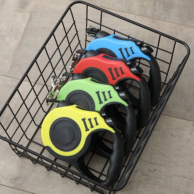 Multicolor retractable pet leash with ergonomic handle and adjustable cord.