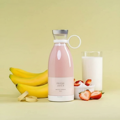 Pink bottle labeled 'Fresh Juice' with bananas, a glass of milk, and strawberries on a yellow background